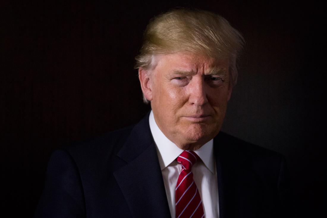 Donald Trump, president and chief executive of Trump Organization Inc. and 2016 Republican presidential candidate, stands for a photograph after a Bloomberg Television interview at his campaign headquarters in Trump Tower in New York, U.S., on Thursday, Oct. 15, 2015. According to Trump, Janet Yellen's decision to delay hiking interest rates is motivated by politics. Photographer: John Taggart/Bloomberg via Getty Images *** Local Capton *** Donald Trump