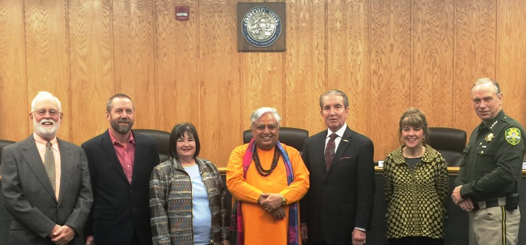 Just before the Hindu invocation, from left to right are—Supervisor John Barrette, Supervisor Brad Bonkowski, Supervisor Lori Bagwell, Hindu statesman Rajan Zed, Mayor Robert L. "Bob" Crowell, Supervisor Karen Abowd, Sheriff Kenneth T. Furlong